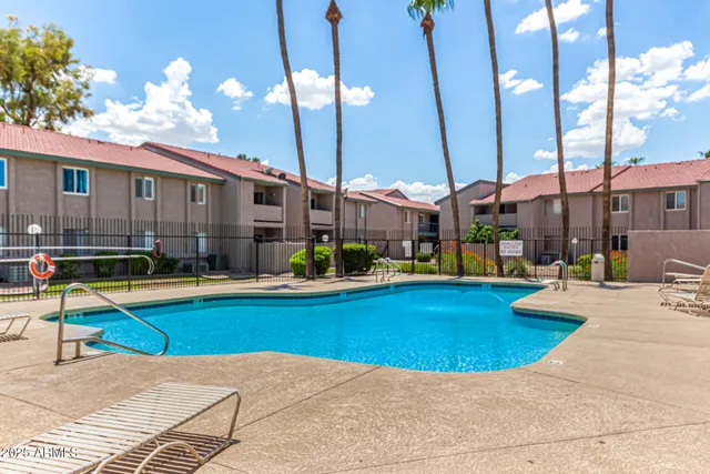 a view of a swimming pool with a lounge chairs