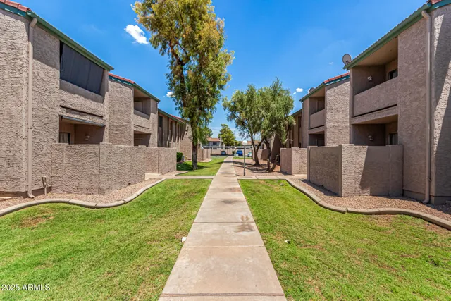 a view of a patio with a yard
