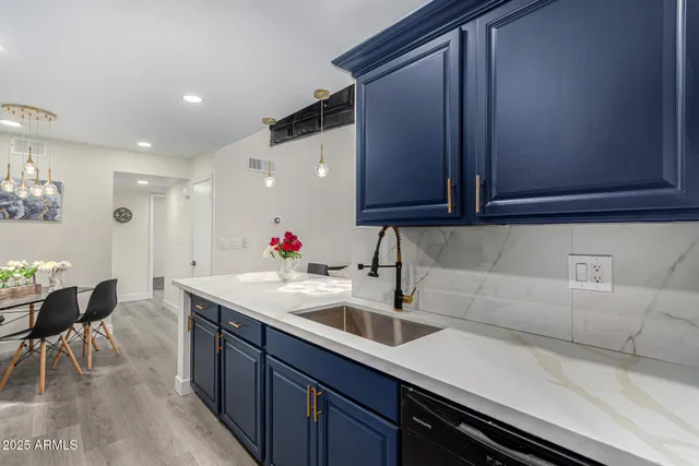 a kitchen with a sink and cabinets
