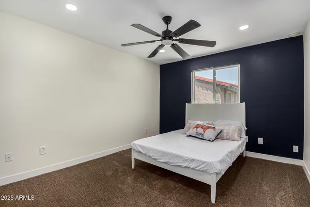 a bedroom with a bed and window