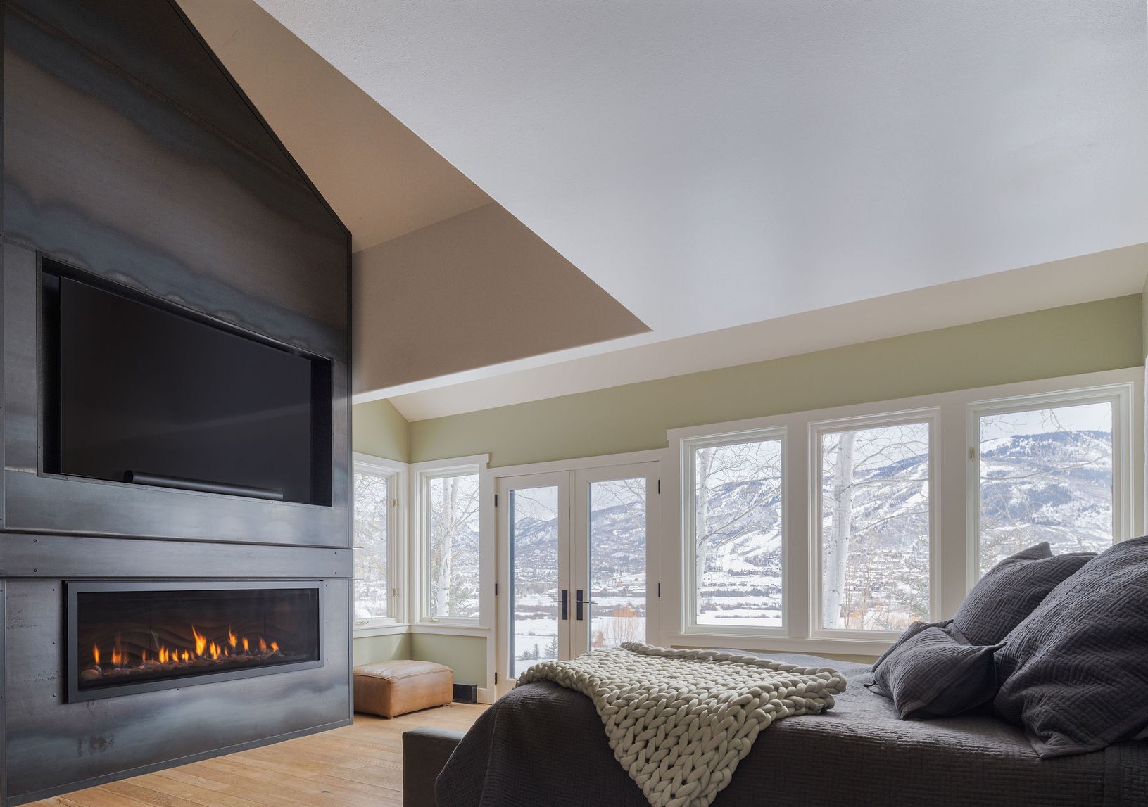 31655 Sugar Ridge Road Steamboat Springs, CO 80487 - Photo 13 of 49 a living room with furniture a flat screen tv and a fireplace