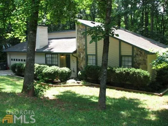 a backyard of a house with lots of green space