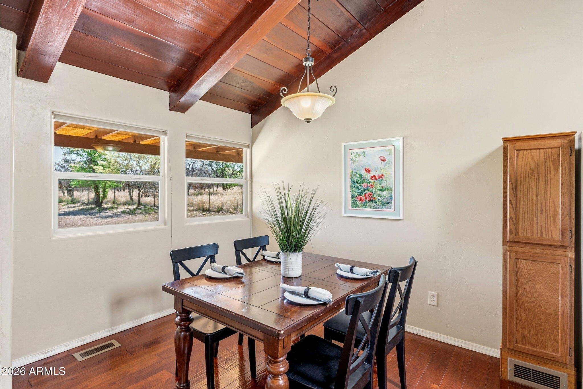 9626 South Turkey Track Road Hereford, AZ 85615 - Photo 17 of 54 a view of a dining room with furniture window and wooden floor