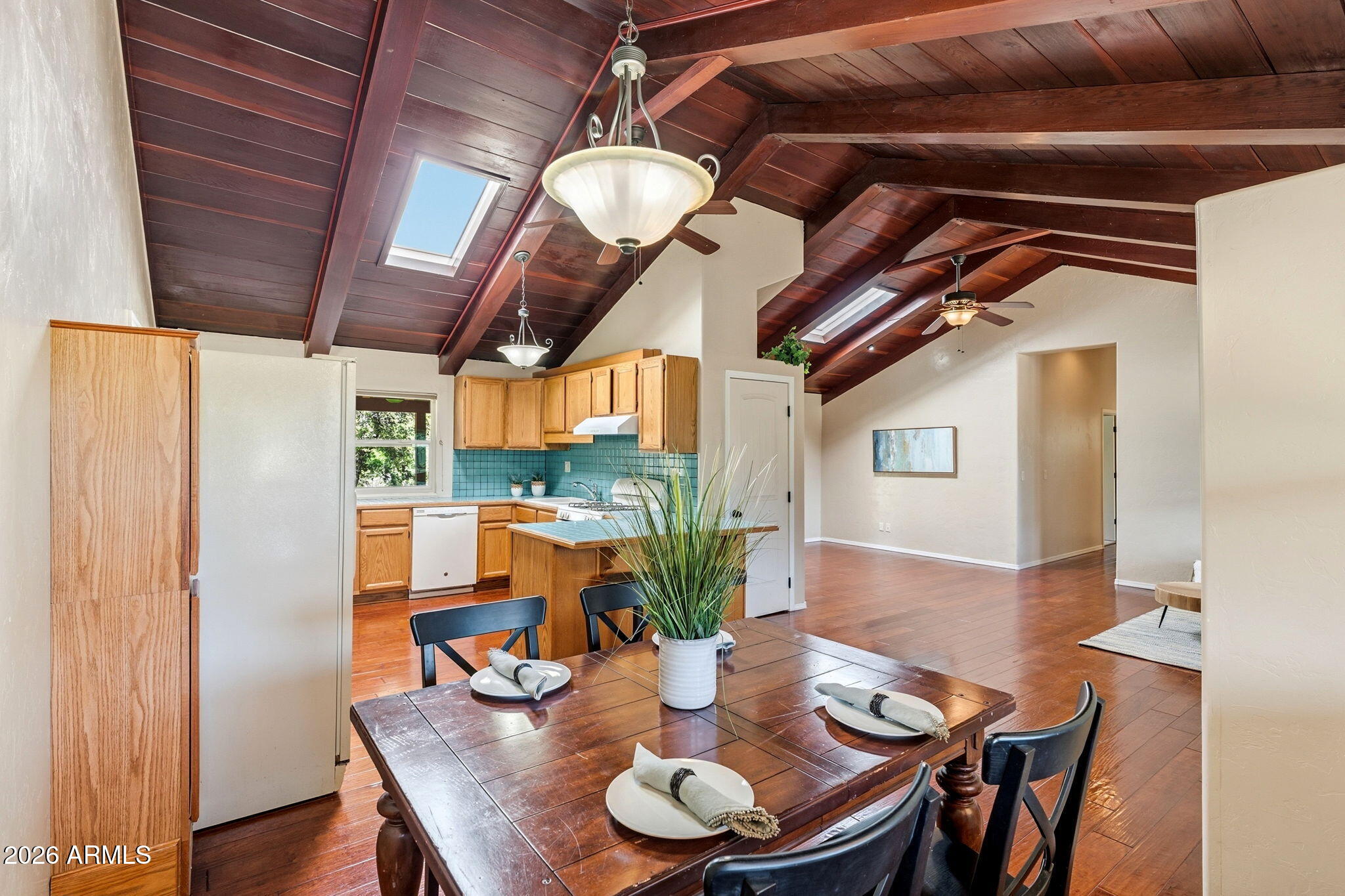9626 South Turkey Track Road Hereford, AZ 85615 - Photo 18 of 54 a view of a dining room with furniture and wooden floor