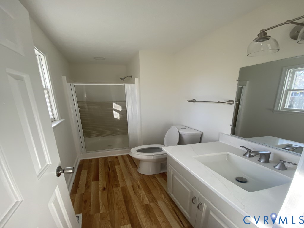 6466 Birch Tree Trace Mechanicsville, VA 23111 - Photo 8 of 8 a bathroom with a sink and mirror with toilet