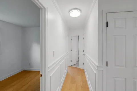 a view of a hallway with white walls