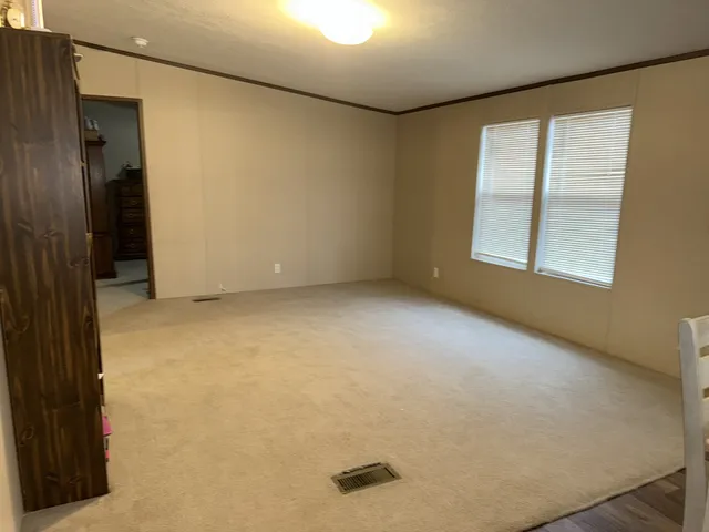 a living room with furniture or flat screen tv and a window