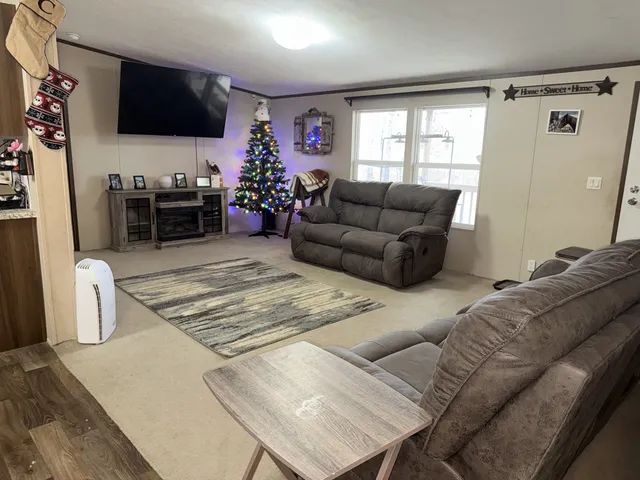 a living room with furniture and a flat screen tv