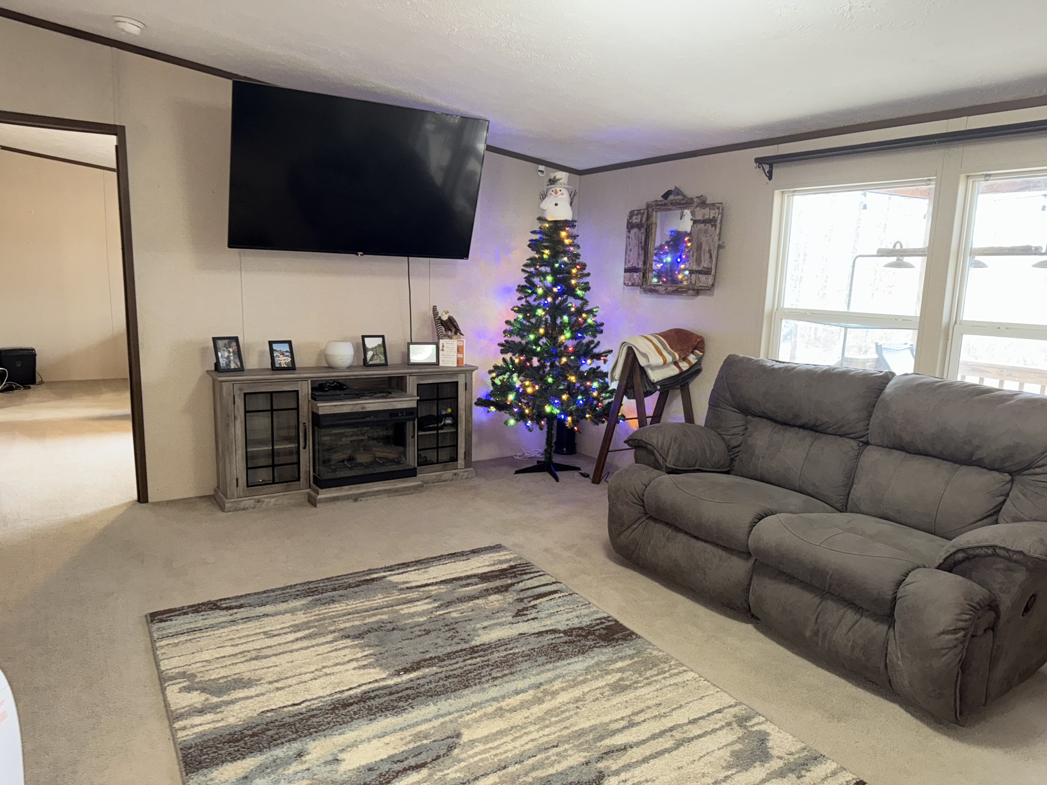 239 Henderson Road Hohenwald, TN 38462 - Photo 14 of 61 a living room with furniture or flat screen tv and a window