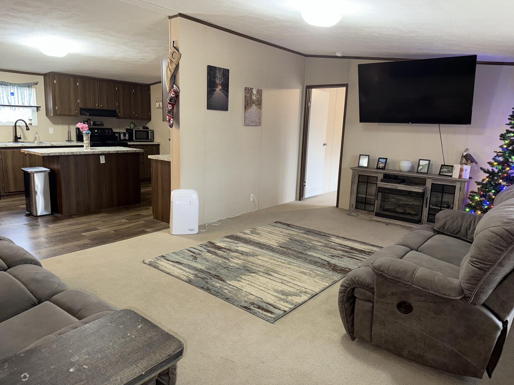 239 Henderson Road Hohenwald, TN 38462 - Photo 15 of 61 a living room with furniture and a flat screen tv