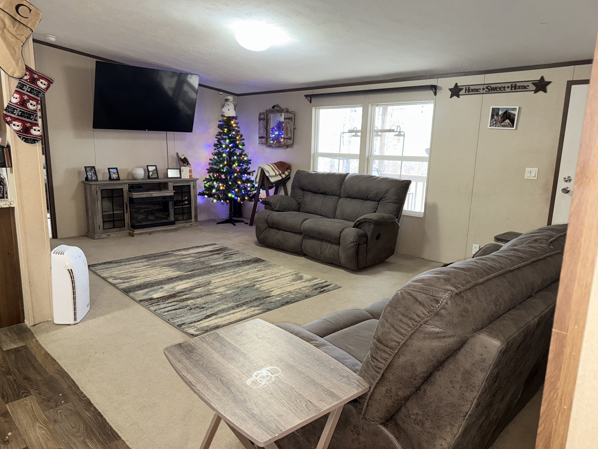 239 Henderson Road Hohenwald, TN 38462 - Photo 16 of 61 a living room with furniture and a flat screen tv