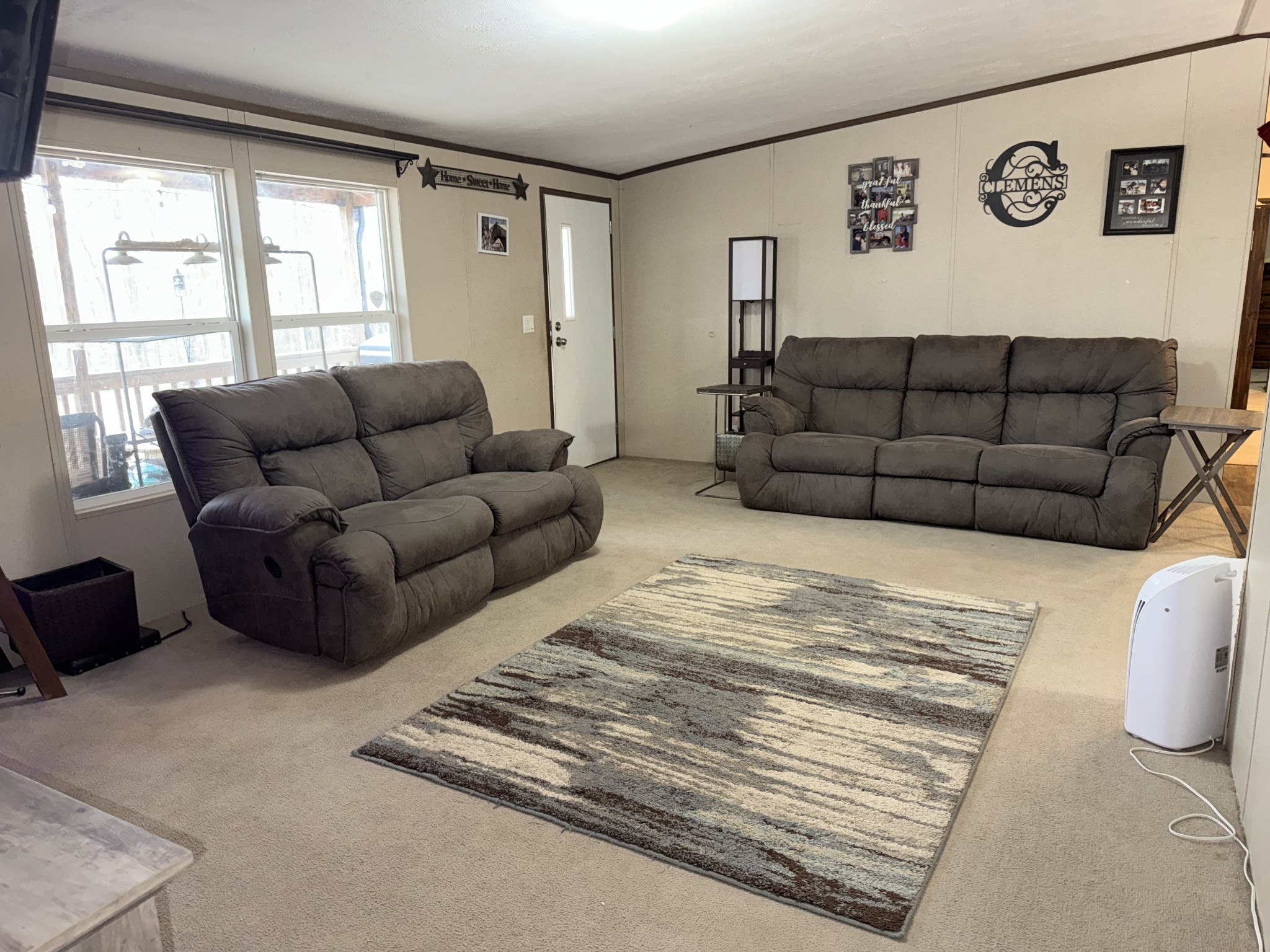239 Henderson Road Hohenwald, TN 38462 - Photo 17 of 61 a living room with furniture and a large window