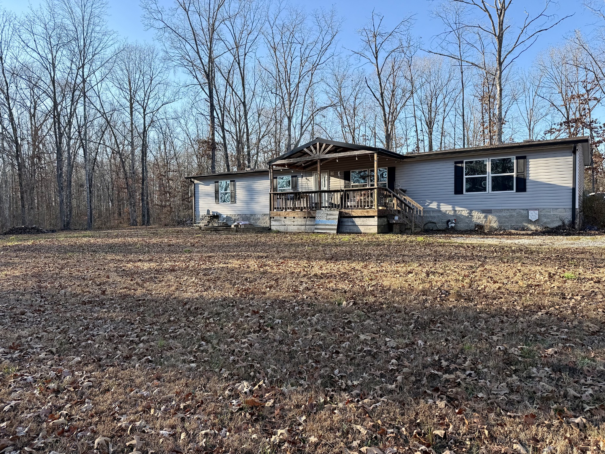 239 Henderson Road Hohenwald, TN 38462 - Photo 2 of 61 a front view of a house with a yard
