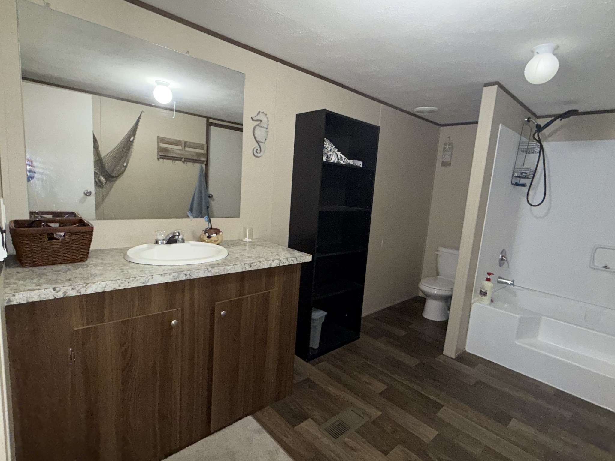 239 Henderson Road Hohenwald, TN 38462 - Photo 22 of 61 a bathroom with a double vanity sink and mirror