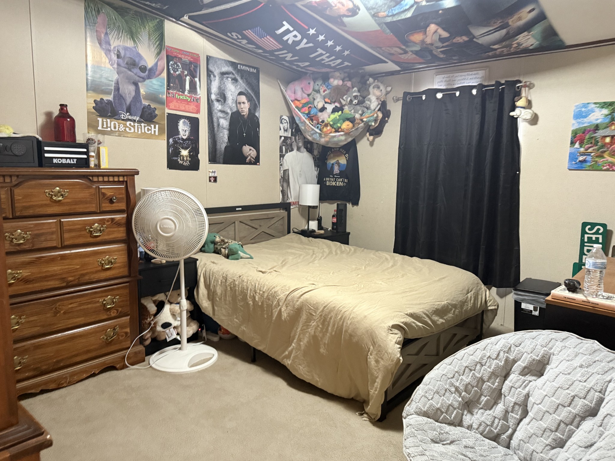 239 Henderson Road Hohenwald, TN 38462 - Photo 30 of 61 a bedroom with bed and a chandelier