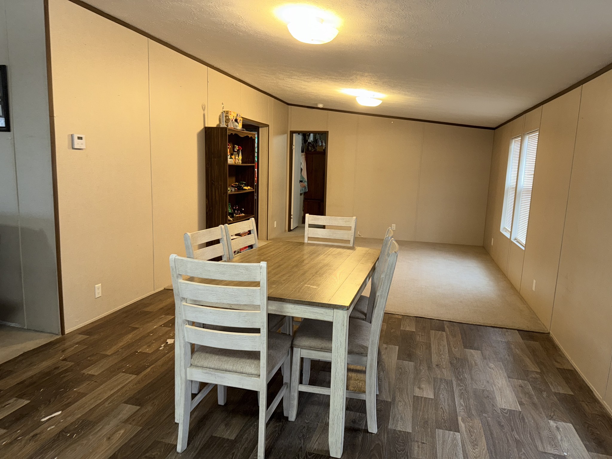 239 Henderson Road Hohenwald, TN 38462 - Photo 8 of 61 a view of a dining room with furniture and wooden floor