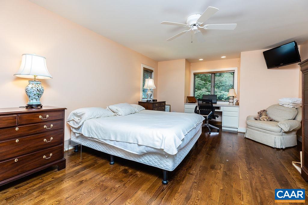 91 Bear Run Wintergreen, VA 22967 - Photo 17 of 54 a bedroom with a bed and a chandelier