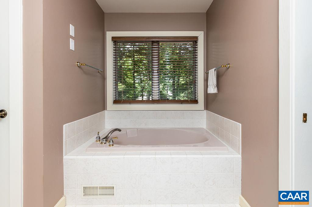 91 Bear Run Wintergreen, VA 22967 - Photo 18 of 54 a bathroom with a tub sink and window