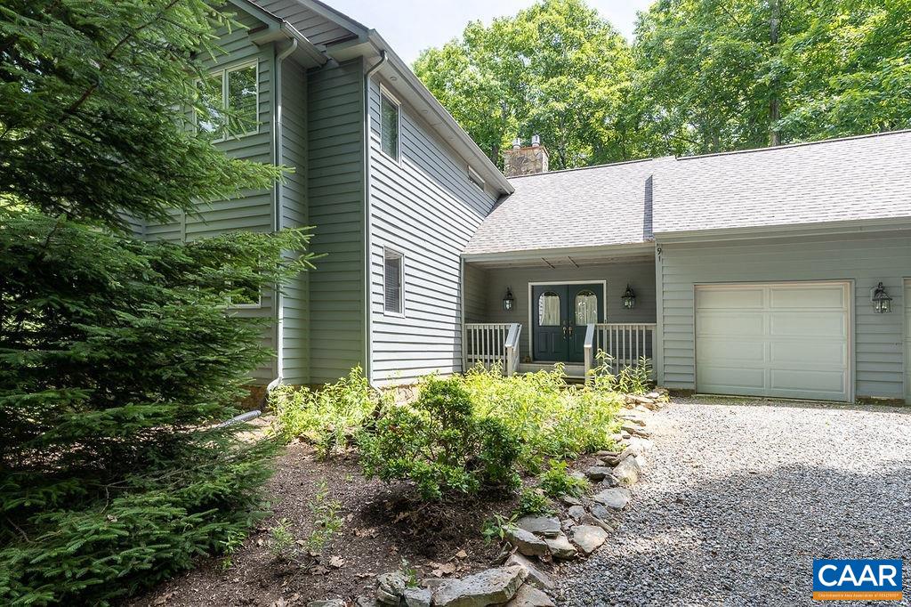 91 Bear Run Wintergreen, VA 22967 - Photo 2 of 54 a front view of a house with garden