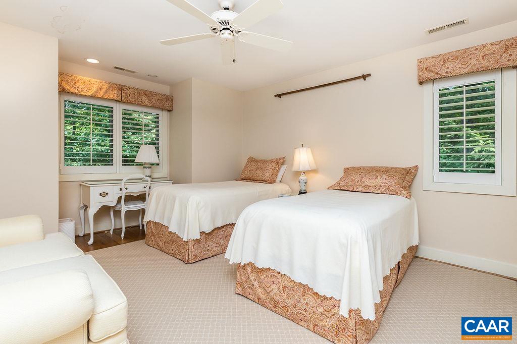 91 Bear Run Wintergreen, VA 22967 - Photo 23 of 54 a bedroom with two beds and a chandelier