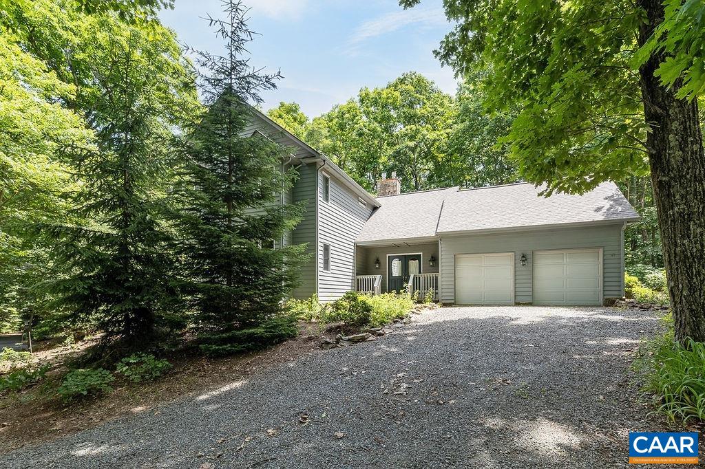 91 Bear Run Wintergreen, VA 22967 - Photo 31 of 54 a front view of a house with a yard and garage