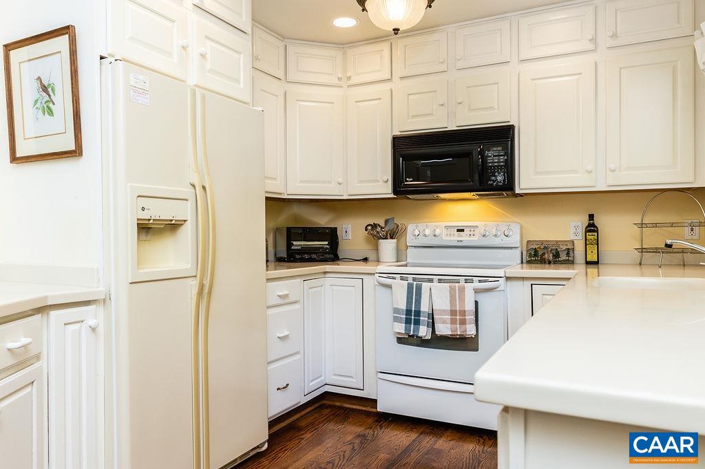 91 Bear Run Wintergreen, VA 22967 - Photo 4 of 54 a kitchen with stainless steel appliances white cabinets and a refrigerator