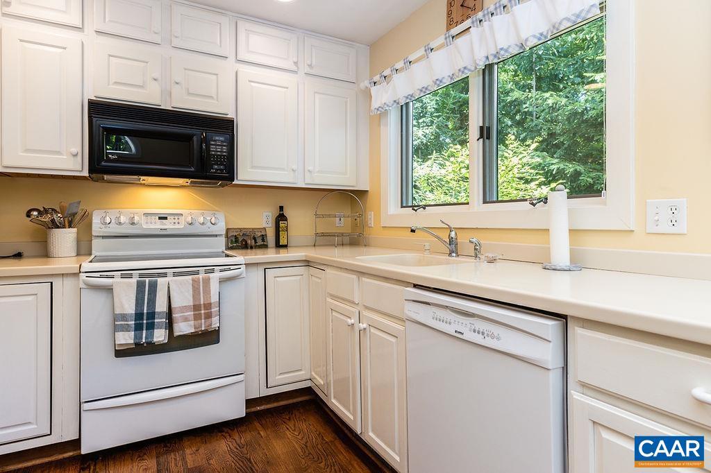 91 Bear Run Wintergreen, VA 22967 - Photo 5 of 54 a kitchen with stainless steel appliances white cabinets and a sink