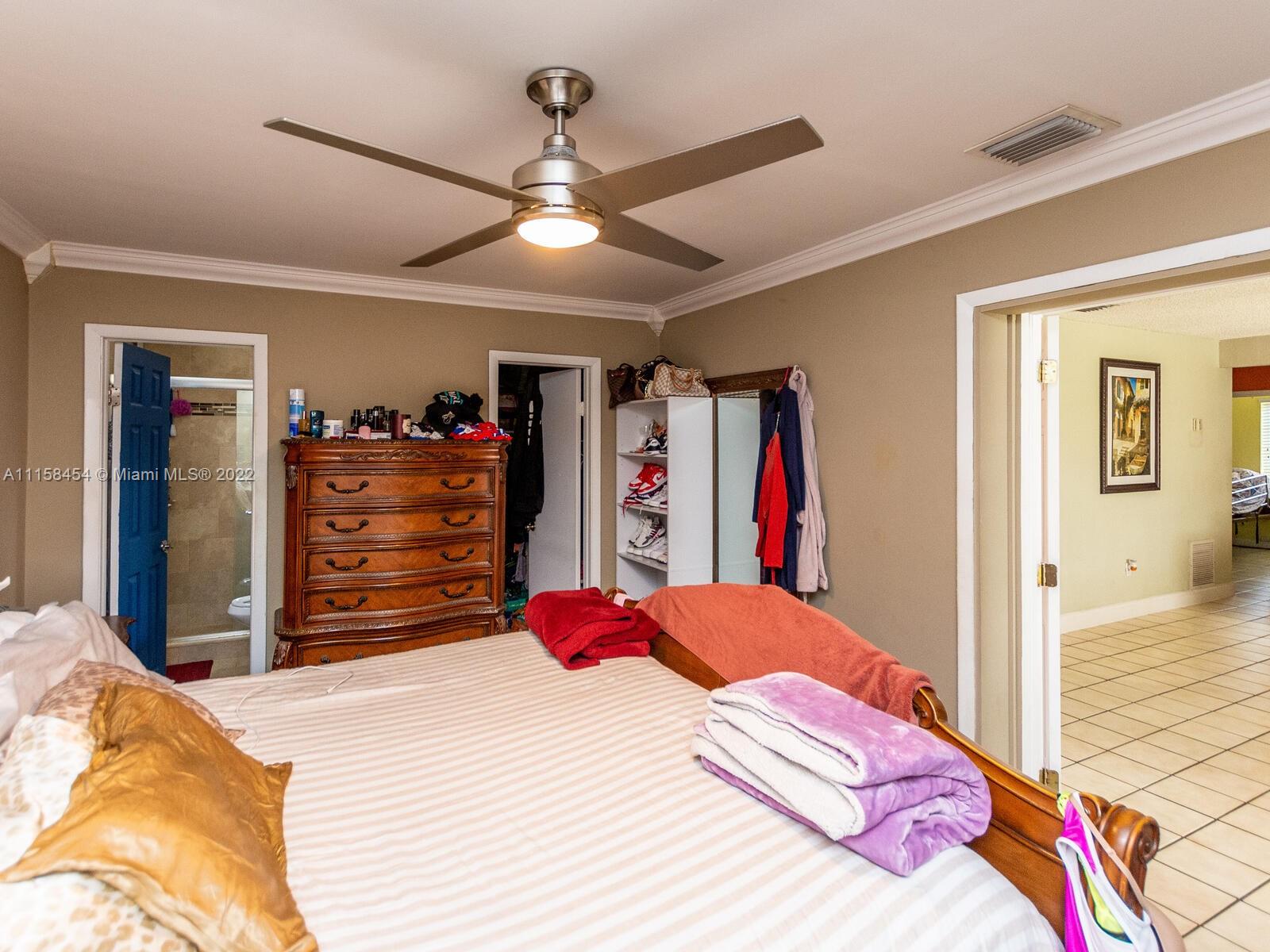 6731 Southwest 5th Terrace Miami, FL 33144 - Photo 12 of 33 a bedroom with a bed and a walk in closet