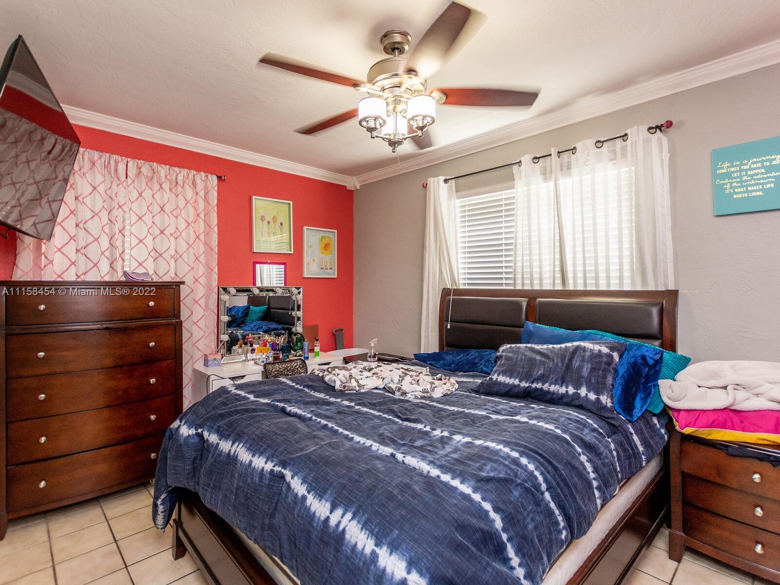 6731 Southwest 5th Terrace Miami, FL 33144 - Photo 19 of 33 a bedroom with a bed and wooden floor