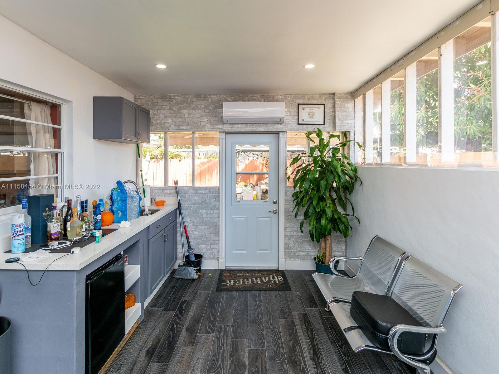 6731 Southwest 5th Terrace Miami, FL 33144 - Photo 22 of 33 a living room with furniture and a potted plant
