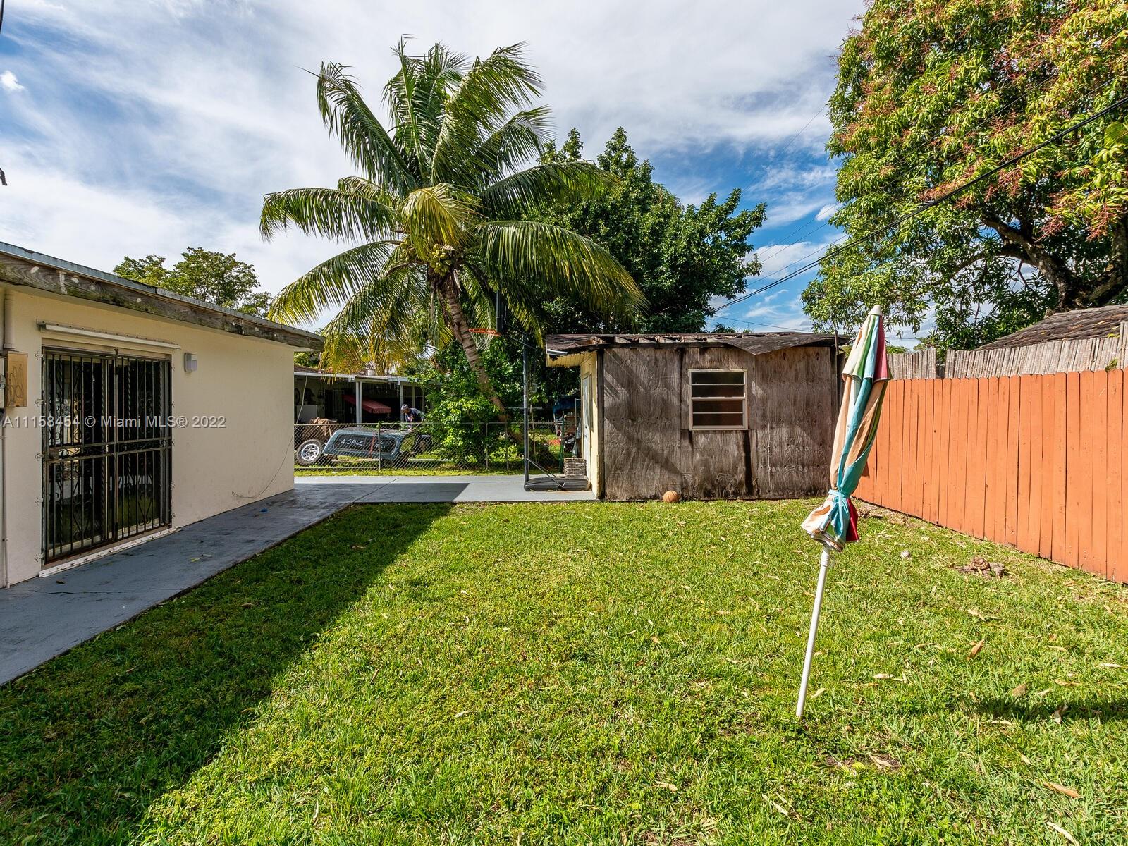 6731 Southwest 5th Terrace Miami, FL 33144 - Photo 27 of 33 a backyard of a house with table and chairs