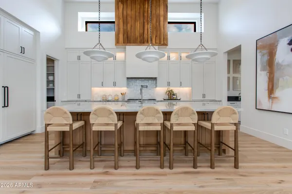 a large kitchen with stainless steel appliances kitchen island granite countertop a large counter top and stove