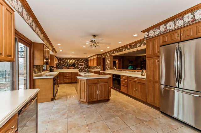 365 Bateman Road Barrington, IL 60010 - Photo 4 of 25 a kitchen with stainless steel appliances kitchen island granite countertop a refrigerator and a stove top oven