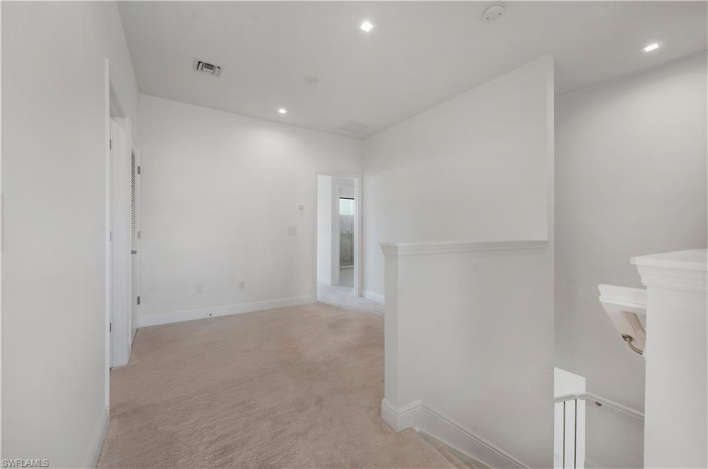 7549 Carnegie Way Naples, FL 34119 - Photo 13 of 22 a view of an empty room