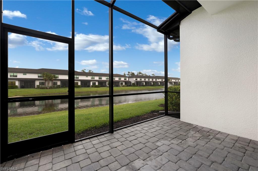 7549 Carnegie Way Naples, FL 34119 - Photo 15 of 22 a view of a floor to ceiling window in an empty room