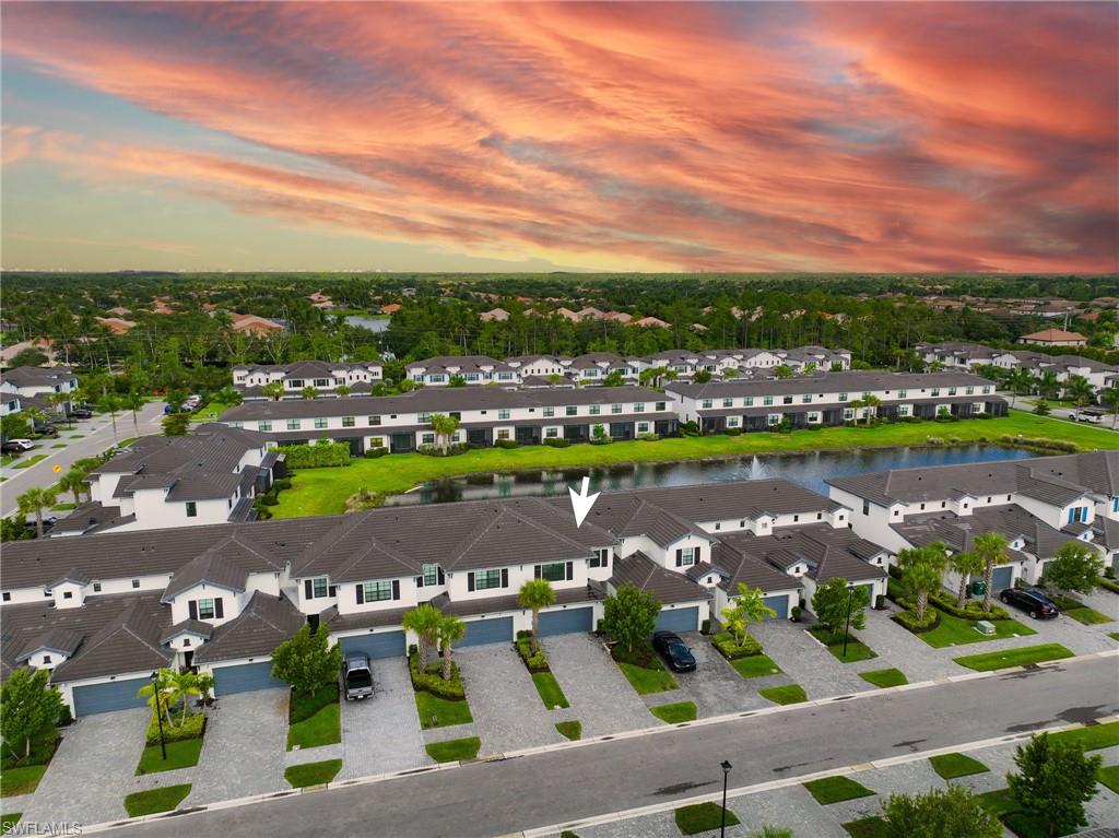 7549 Carnegie Way Naples, FL 34119 - Photo 18 of 22 an aerial view of a city with lots of residential buildings ocean and mountain view in back