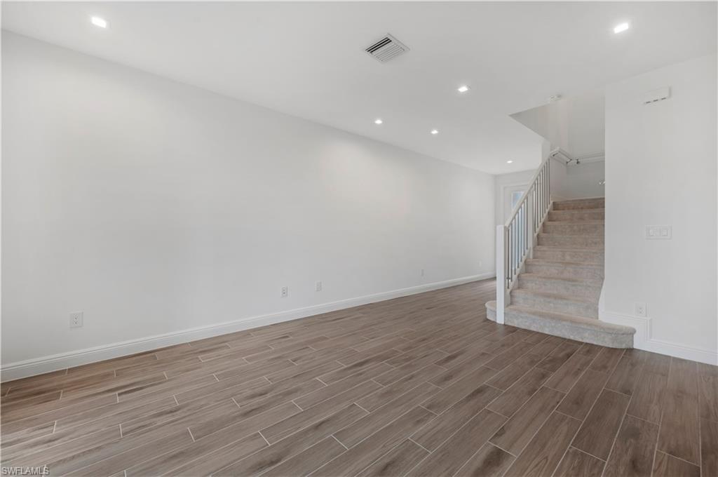 7549 Carnegie Way Naples, FL 34119 - Photo 5 of 22 a view of entryway with wooden floor