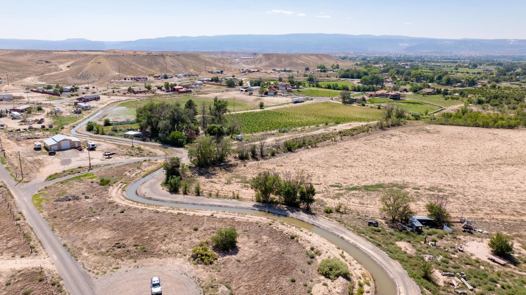 267 33 Road Palisade, CO 81526 - Photo 20 of 42 an aerial view of a house with a mountain