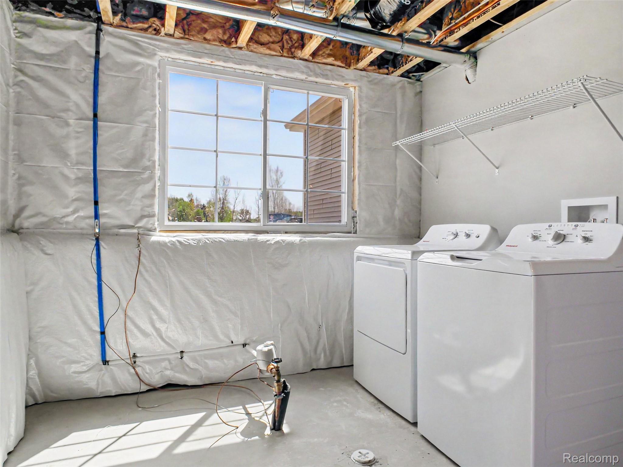3166 Quail Ridge Court Clio, MI 48420 - Photo 16 of 23 The utility room has plenty of storage and the Washer & Dryer is included!
