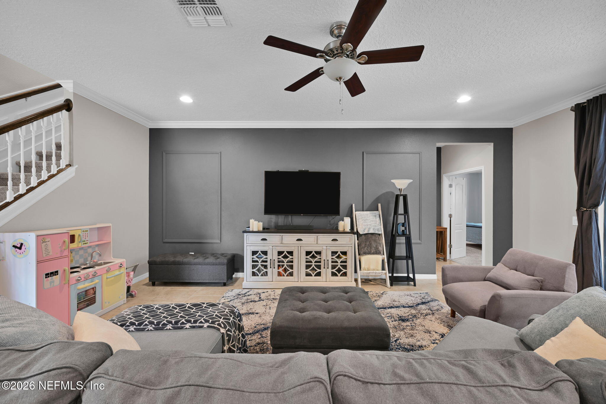 212 North Arabella Way St. Johns, FL 32259 - Photo 16 of 83 a living room with furniture and a flat screen tv