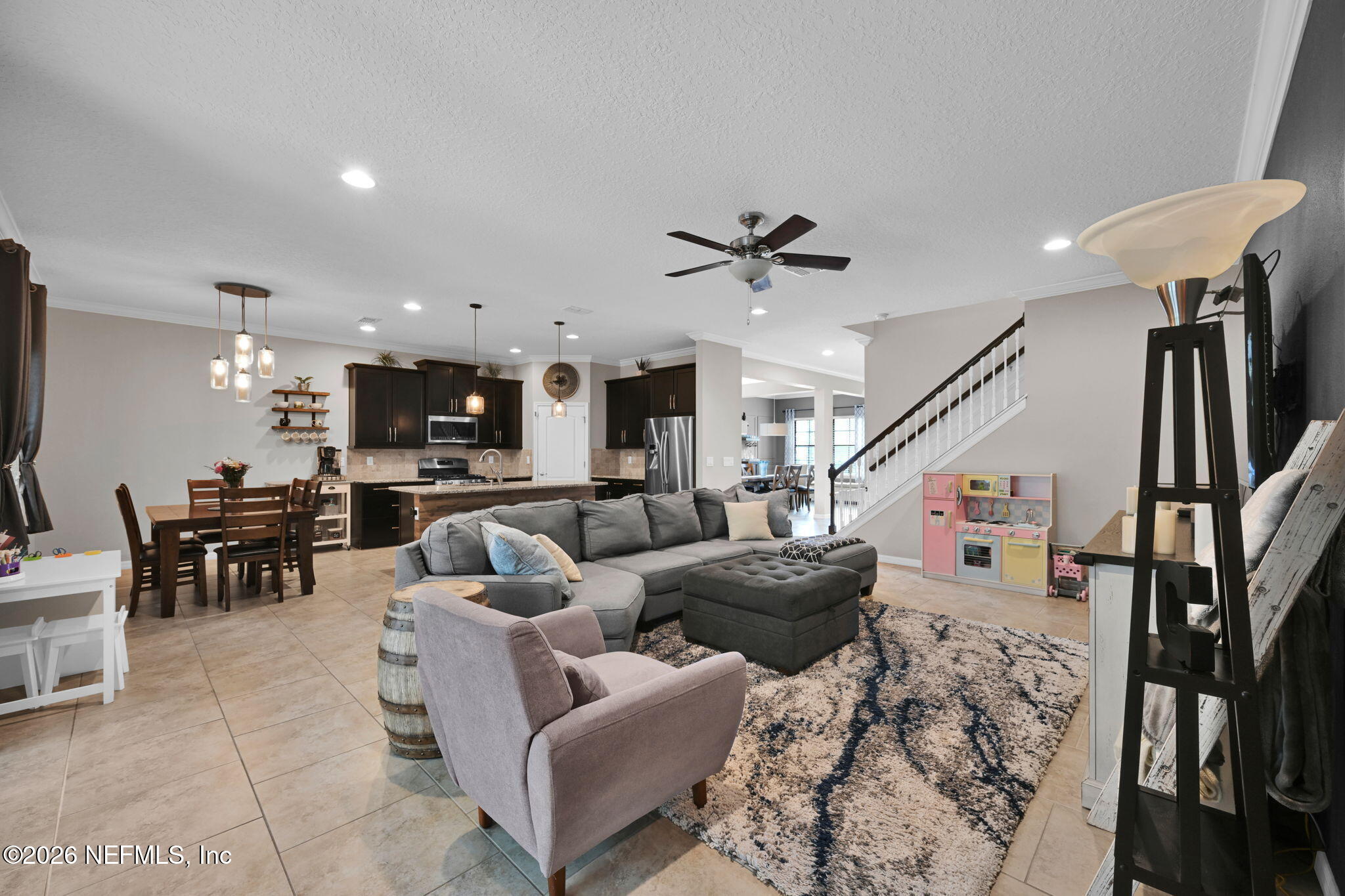 212 North Arabella Way St. Johns, FL 32259 - Photo 19 of 83 a living room with furniture kitchen view and a wooden floor