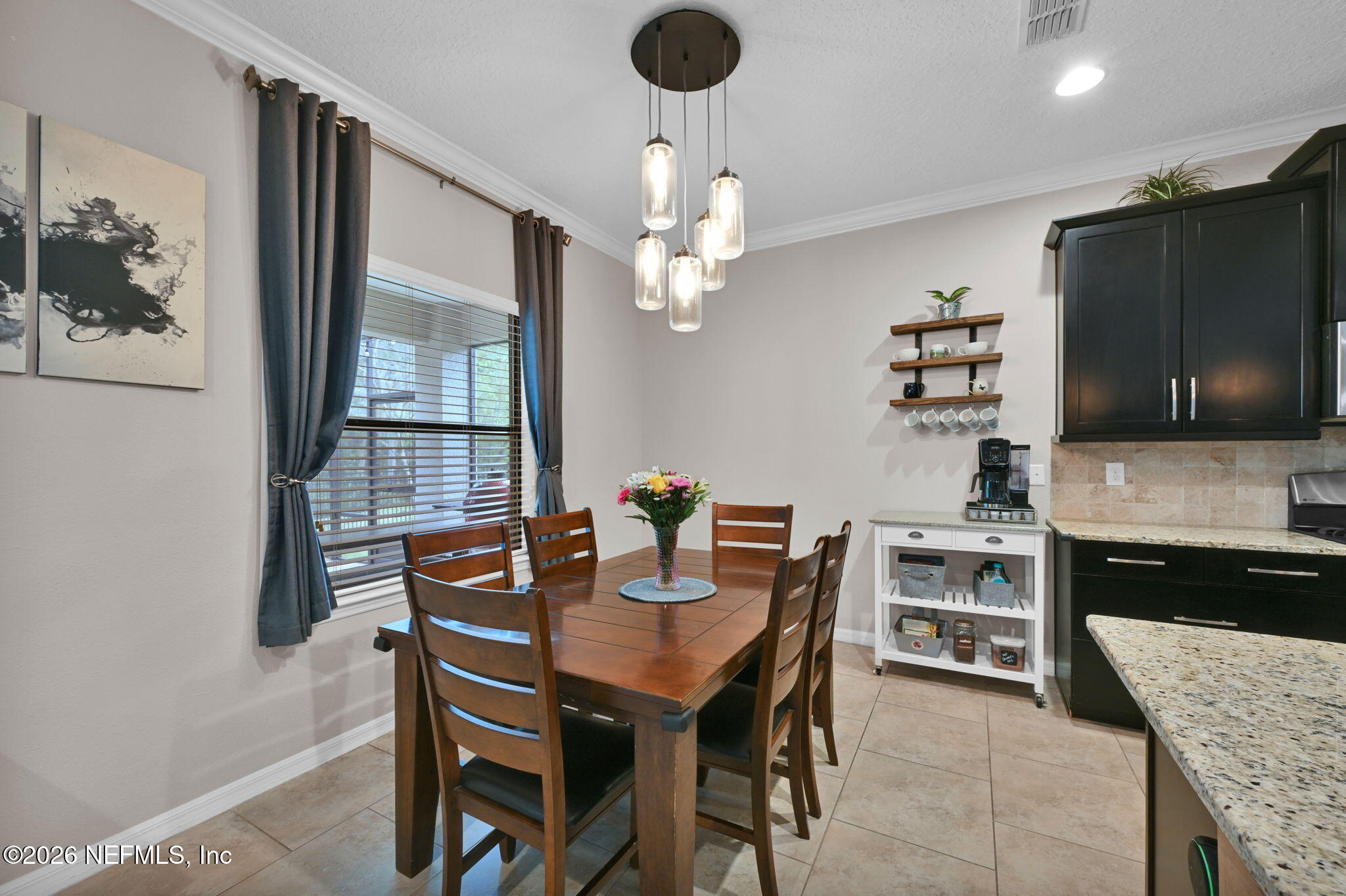 212 North Arabella Way St. Johns, FL 32259 - Photo 25 of 83 a view of a dining room with furniture and chandelier