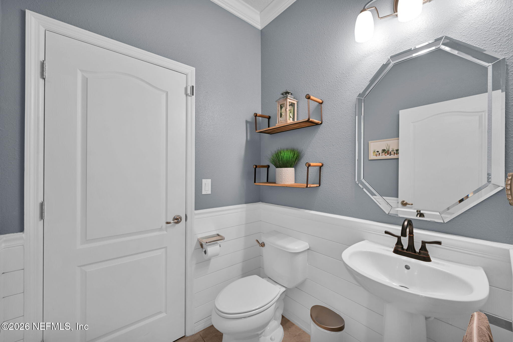 212 North Arabella Way St. Johns, FL 32259 - Photo 27 of 83 a bathroom with a toilet sink and mirror