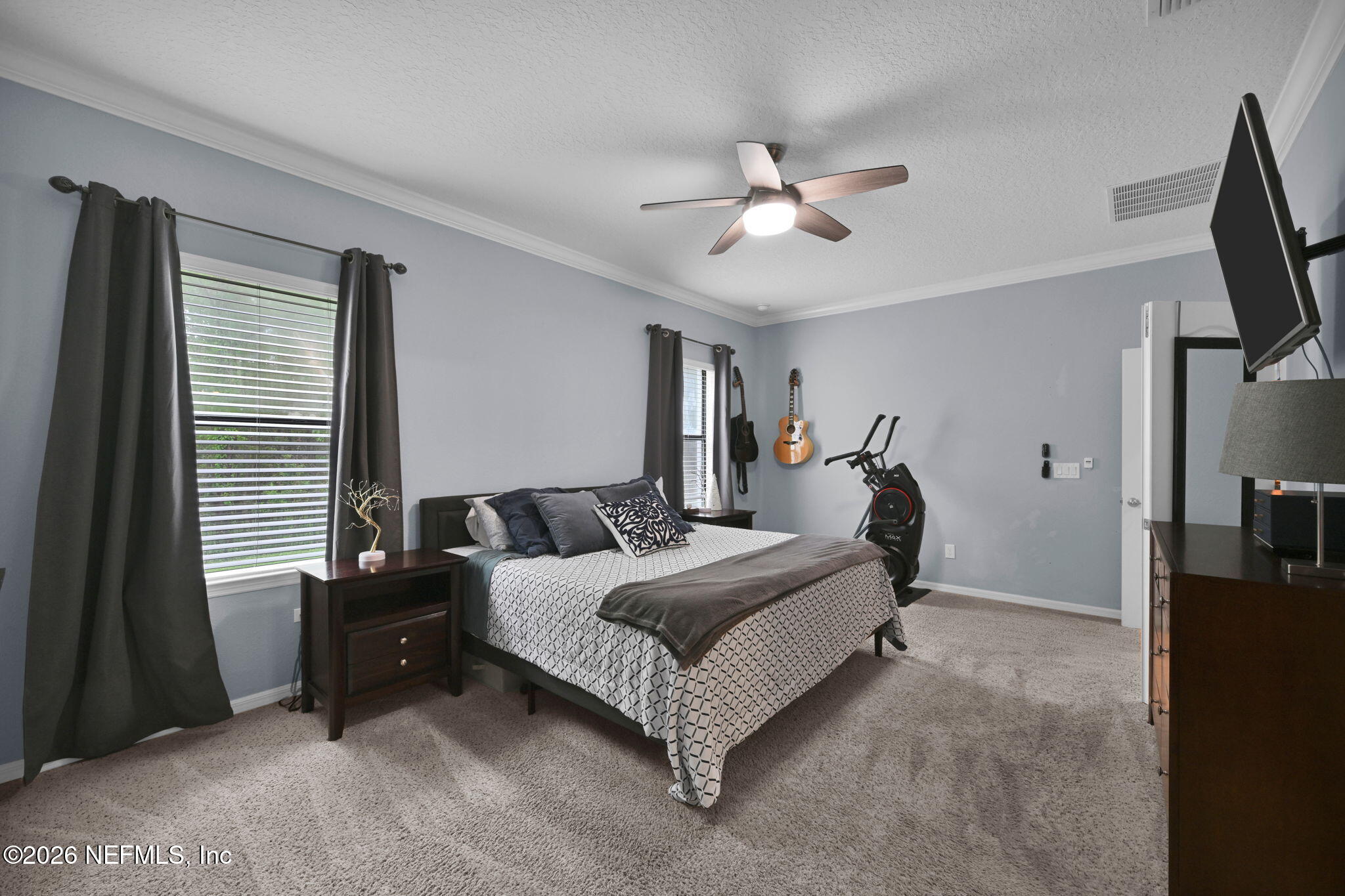 212 North Arabella Way St. Johns, FL 32259 - Photo 30 of 83 a bedroom with a bed couch and a window