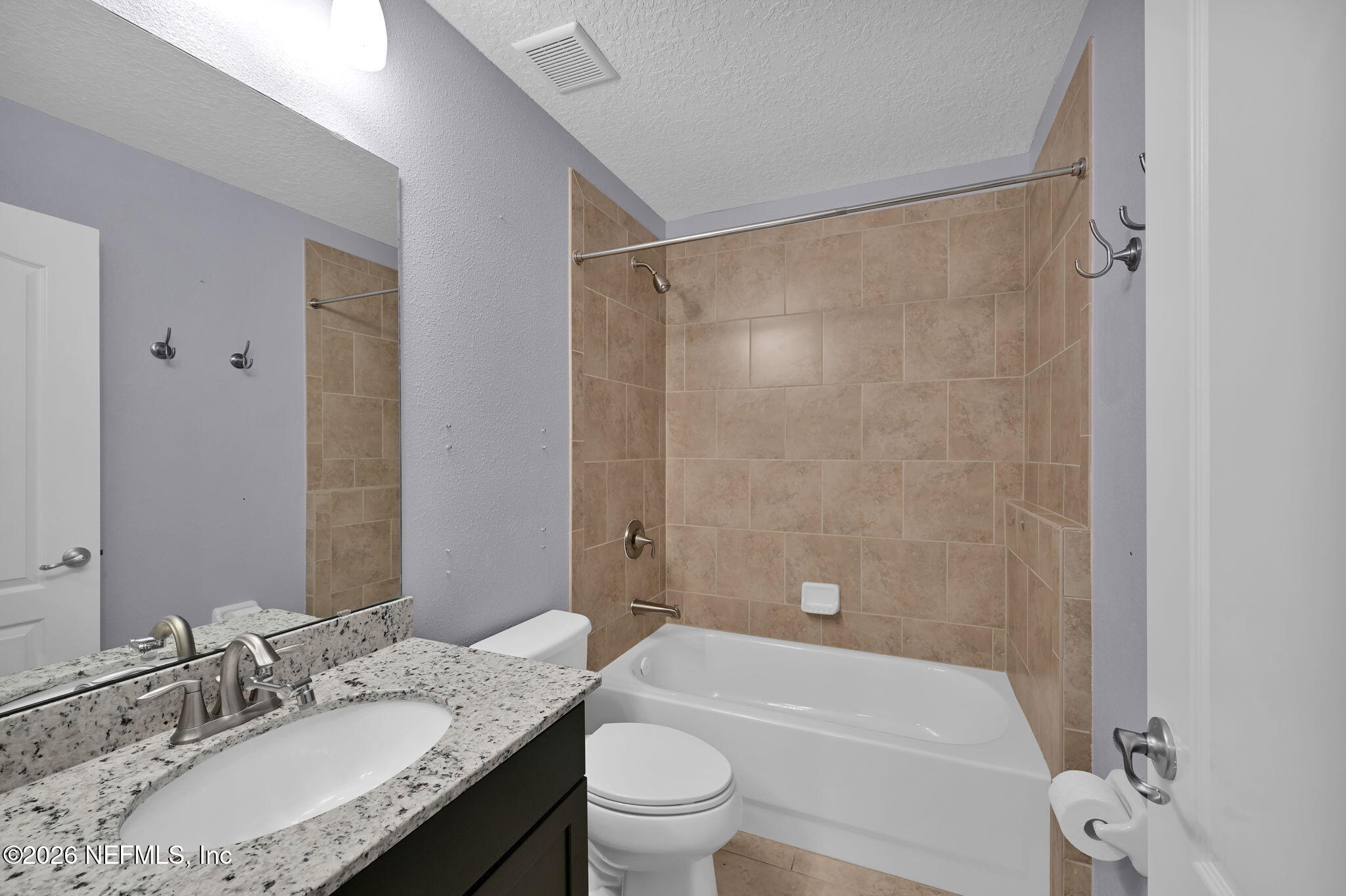 212 North Arabella Way St. Johns, FL 32259 - Photo 40 of 83 a bathroom with a granite countertop sink toilet and shower