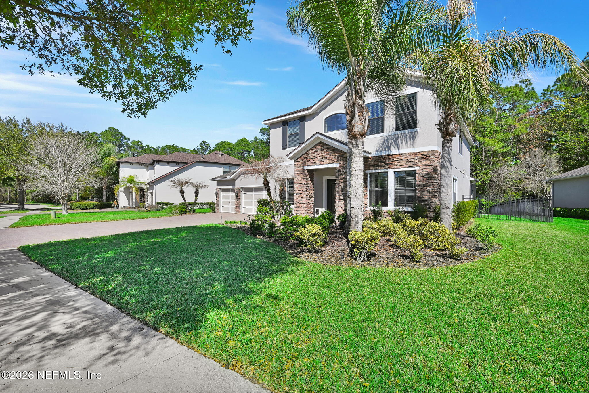 212 North Arabella Way St. Johns, FL 32259 - Photo 4 of 83 a front view of a house with garden