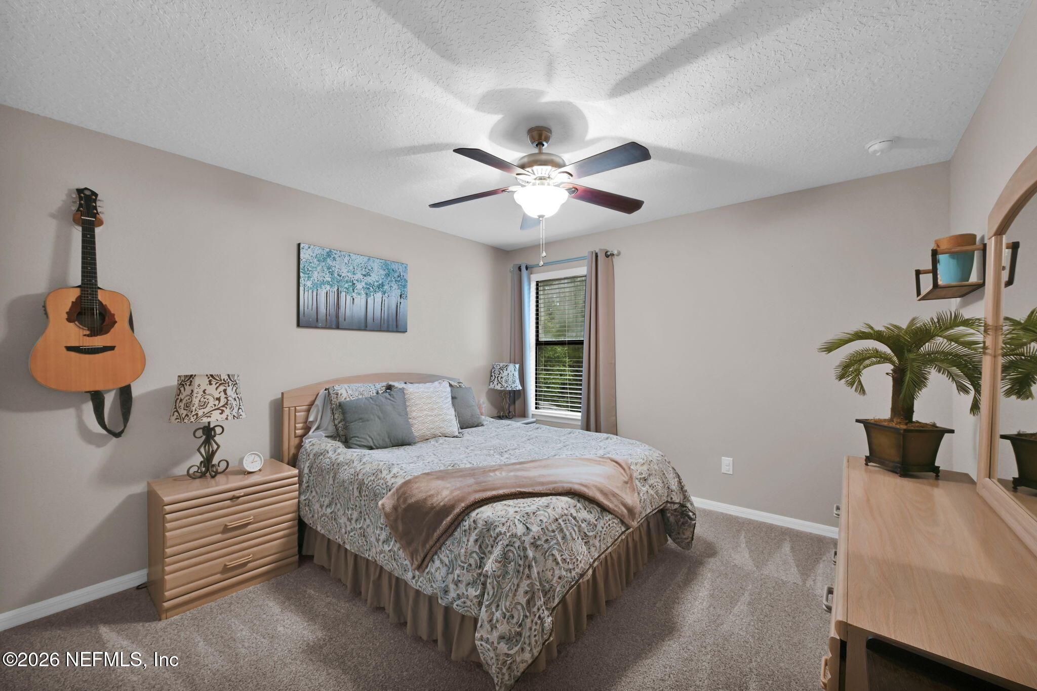 212 North Arabella Way St. Johns, FL 32259 - Photo 42 of 83 a bedroom with a bed and a chandelier