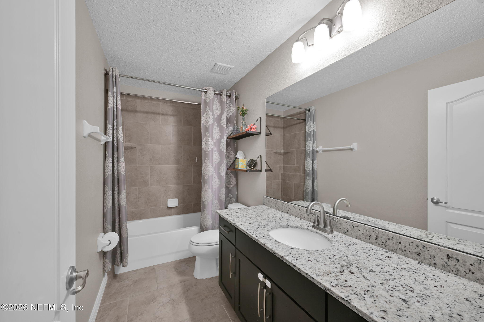 212 North Arabella Way St. Johns, FL 32259 - Photo 43 of 83 a bathroom with a granite countertop sink a toilet and shower