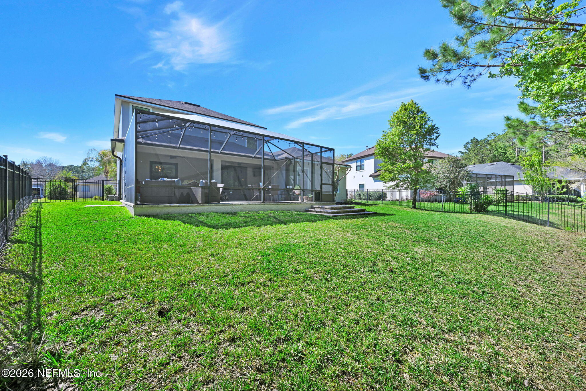 212 North Arabella Way St. Johns, FL 32259 - Photo 51 of 83 a backyard of a house with lots of green space and fountain