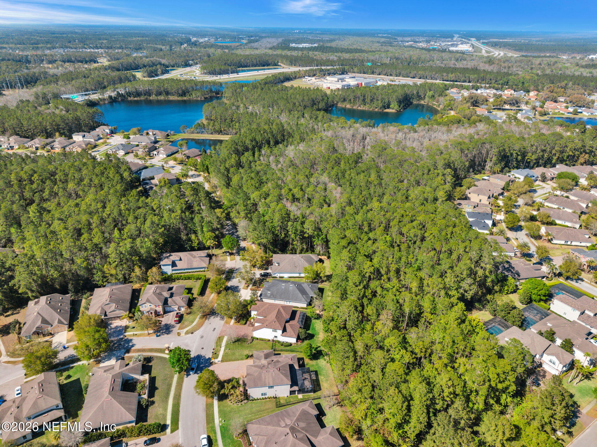 212 North Arabella Way St. Johns, FL 32259 - Photo 59 of 83 an aerial view of residential building with outdoor space and lake view